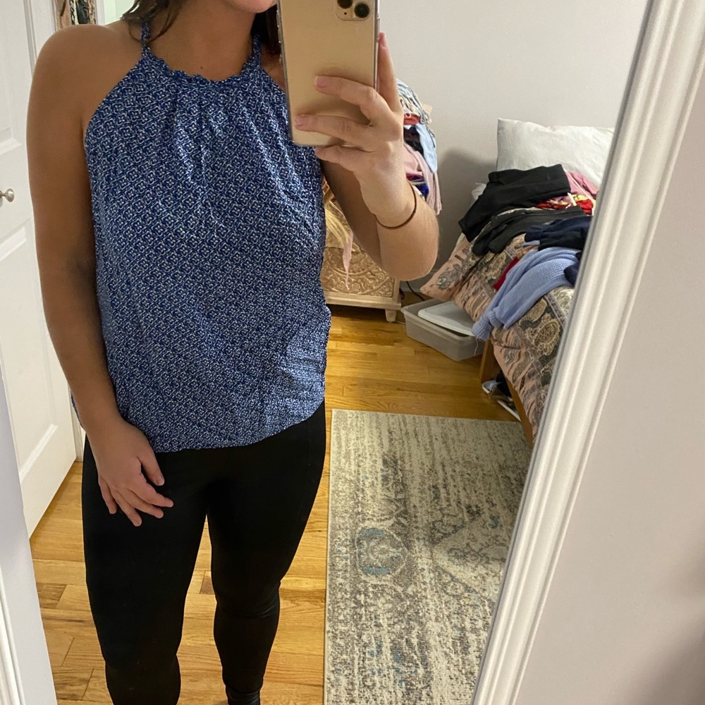 Blue floral print top with a ruffled detail!